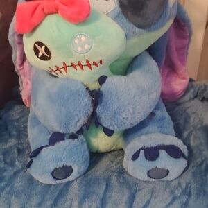 Blue and Green Plush Toy with Pink Bow